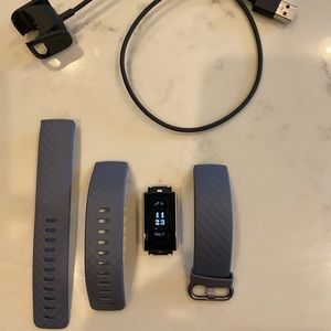 Fitbit charge 3.  Waterproof up to 50 meters...